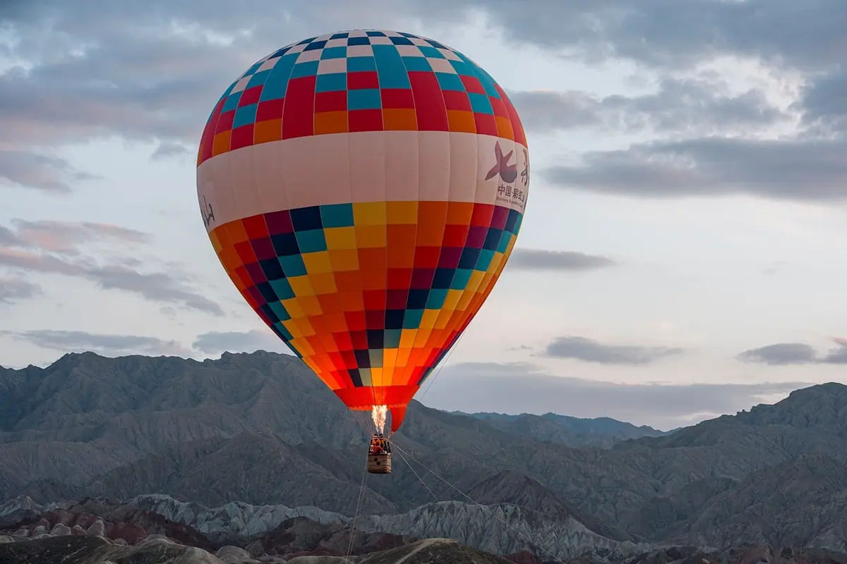 A hot air balloon over mountains